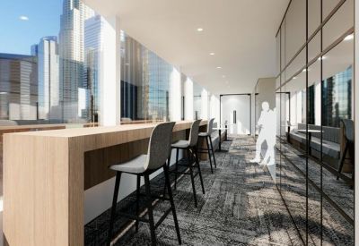 Bright co-working bench overlooking skyscrapers through floor-to-ceiling windows.