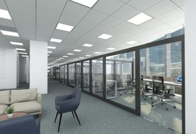 A hallway lined with glass-partitioned private offices and soft grey carpeting.