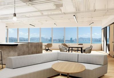 Bright communal lounge and kitchen area with panoramic harbor views.