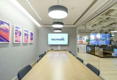 Comfortable corner office with city views and modern decor.