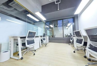 Sleek, modern workspace featuring ergonomic chairs and glass partitions.