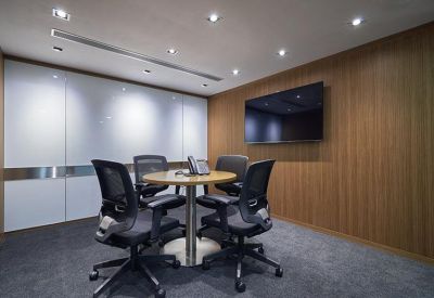 Professional internal office suite with ergonomic chairs and window views.