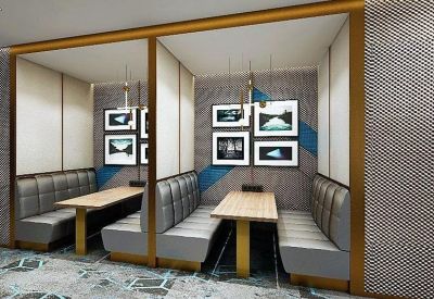 Professional boardroom with a long white table and integrated display screen.