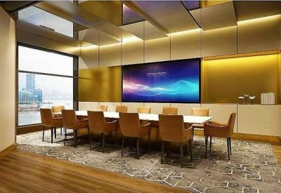 Wide panoramic view of the city skyline and harbor during the day.