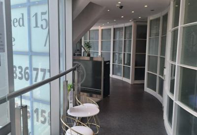 Bright glass-walled corridor at 14/F-18/F Radio City with natural light and seating.