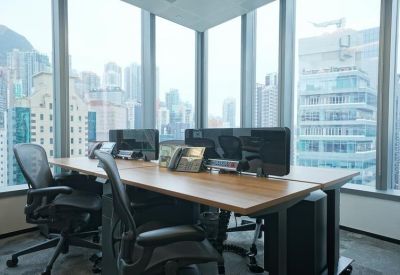 Bright corner office with ergonomic chairs and city views.