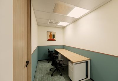Private office suite with two desks and teal wainscoting.