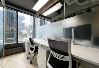 A two-person private office with city skyline views from Tower 1, Admiralty Centre.