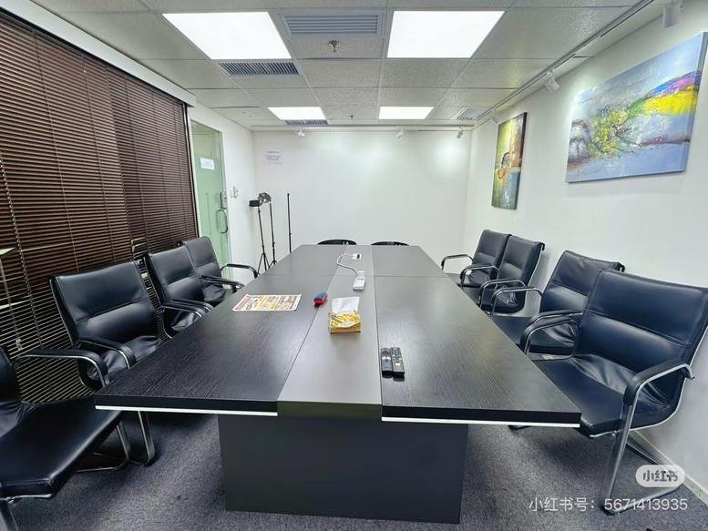 Meeting room at 14, 科學館道, TSIM SHA TSUI with a large dark wood table, black leather chairs, and wall art.