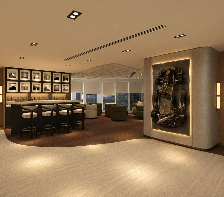 Spacious lounge area at Tower One, Lippo Centre featuring a bar, racing-themed wall art, and warm lighting.