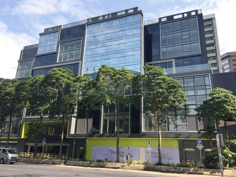Exterior view of the modern glass-fronted commercial building at 8 Wang Kwong Road.