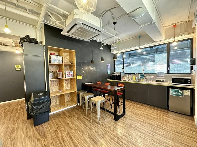 Spacious communal breakroom at 118 Wai Yip Street with a kitchen counter and dining table.