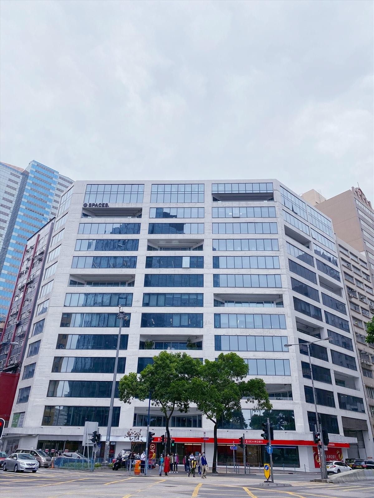 Exterior view of the modern glass-fronted building at 133 Wai Yip Street, The Grid.