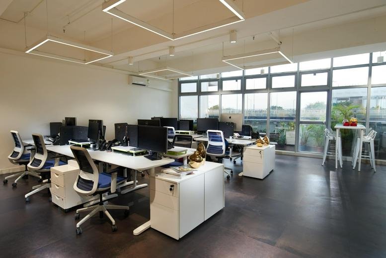Spacious open-plan workspace at 141 Connaught Road West, 2/F BUPA Centre with modern lighting and city views.