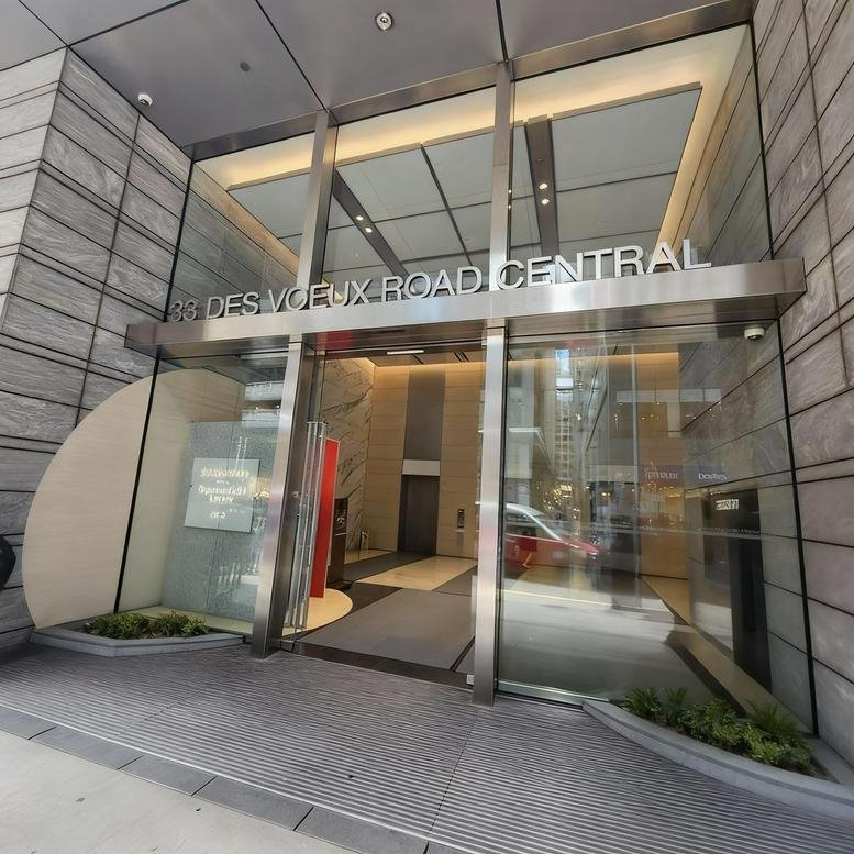 Glass entrance and facade of the 141 Des Voeux Road Central, China Insurance Group Building.