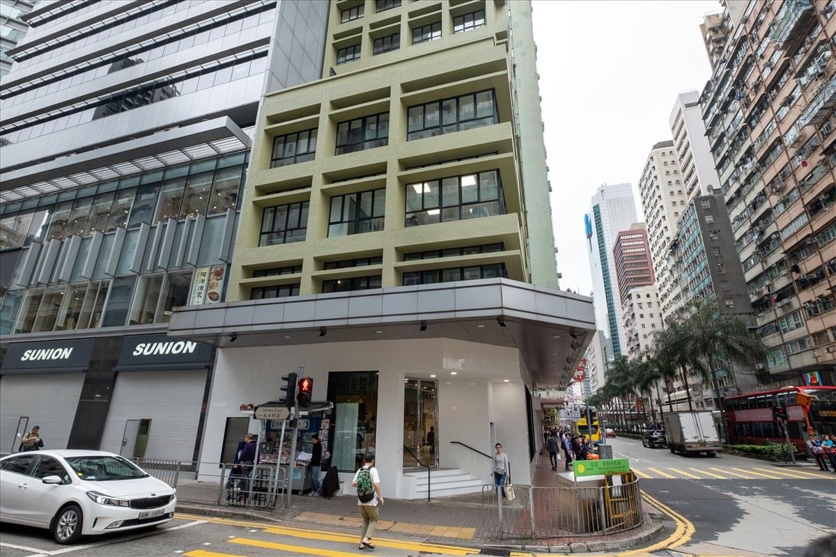 Exterior view of the green and glass building facade at 200 Hennessy Road, Wanchai.