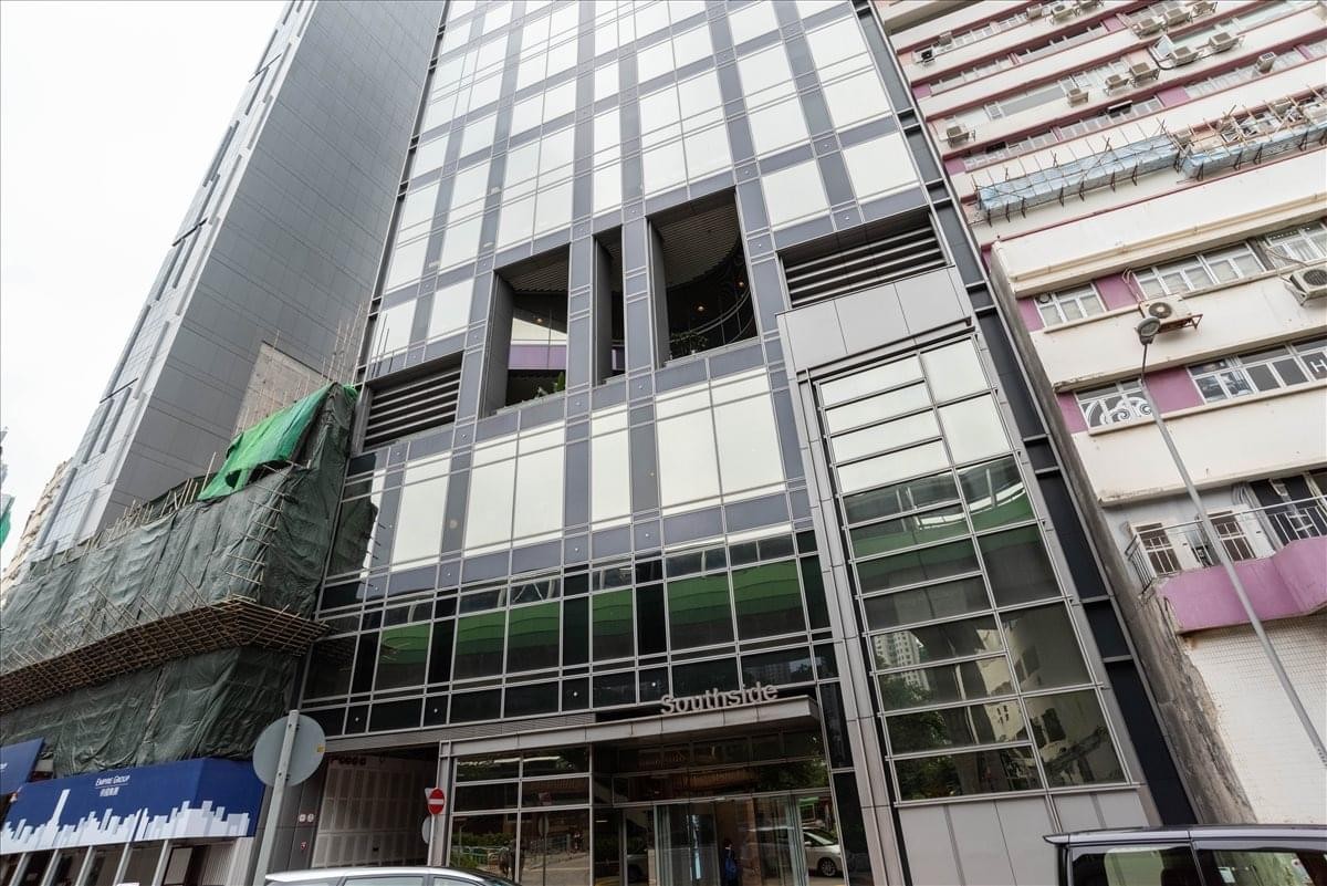 Exterior view of the modern glass-facade building at 38 Wong Chuk Hang Road.