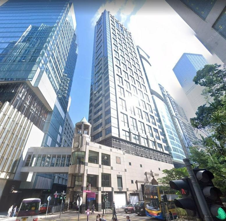 Exterior view of the glass-facade building at 9 Queen’s Road Central.