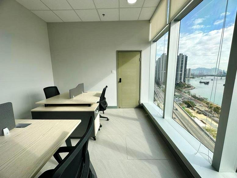 Panoramic window view of the harbor from the light-filled office at TML Tower.