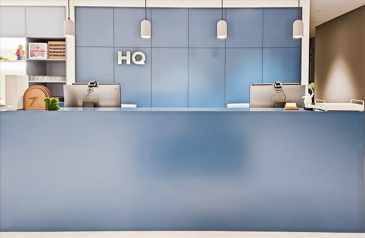 Sleek blue reception desk at K11 Atelier, 728 King’s Road, 5th Floor, Quarry Bay.