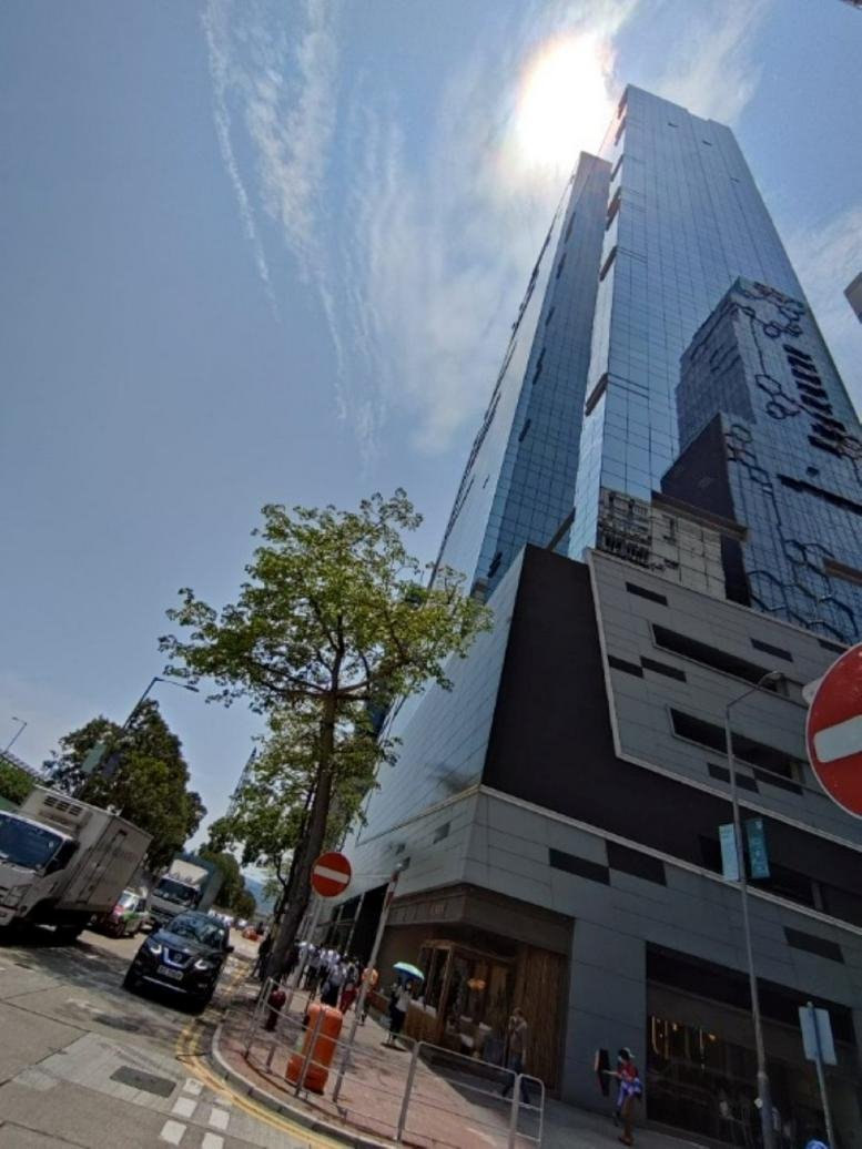 Exterior view of the modern glass-facade skyscraper at King Palace Plaza.