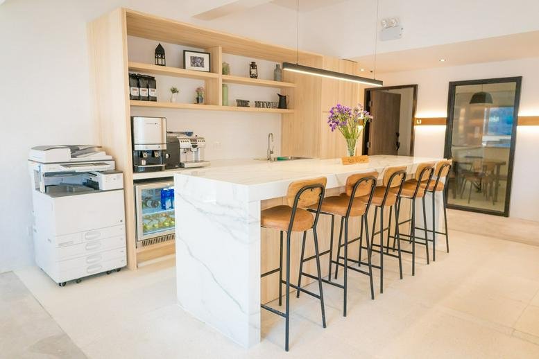 Spacious communal kitchen and marble island at Liberal Factory Building, 3 Wing Ming Street.