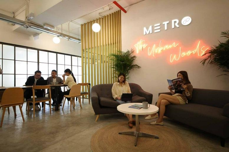 Spacious lounge at Remex Centre, 42 Wong Chuk Hang Road with neon signage and comfortable seating areas.