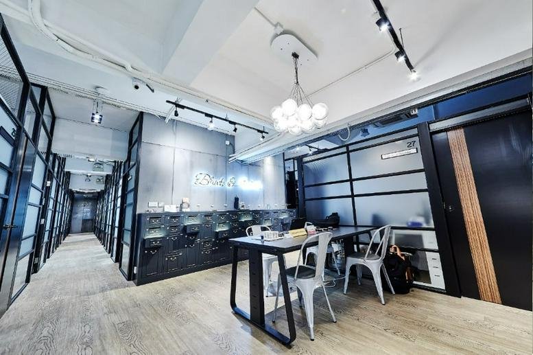 Reception and communal area at Seaview Estate featuring a modern front desk and pendant lighting.
