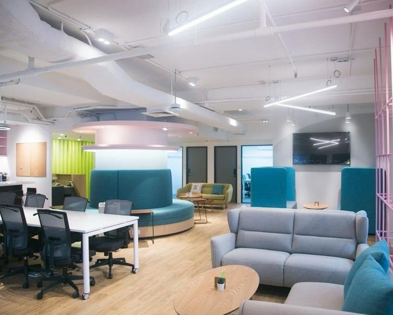 Spacious communal lounge at Sunbeam Centre featuring colorful pods and modern furniture.