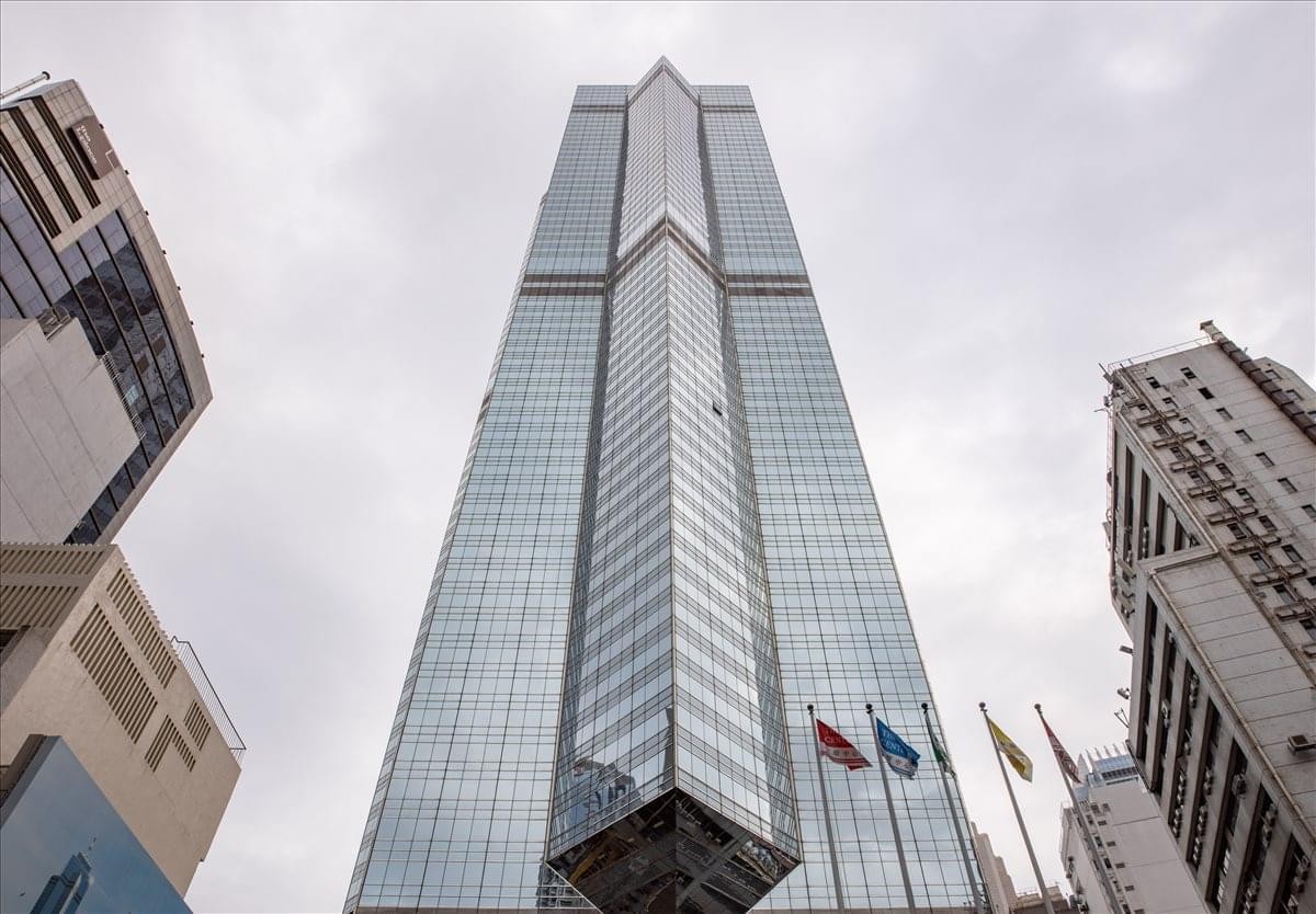 Exterior view of the iconic glass skyscraper facade at The Center, 99 Queens Road.