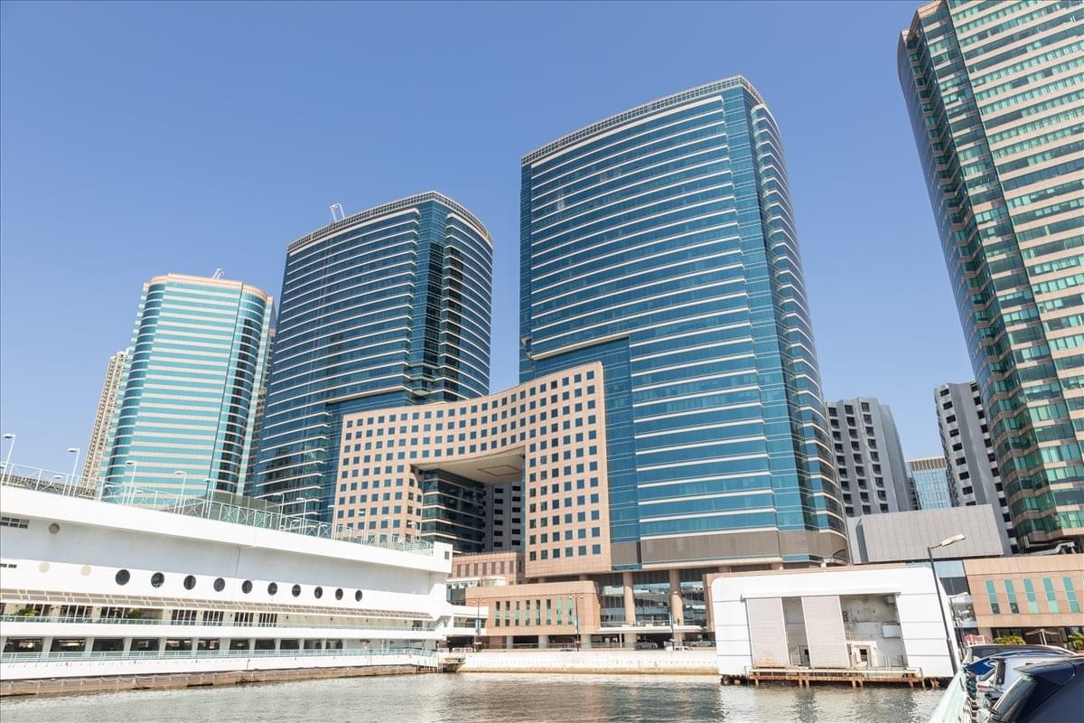 Exterior view of the modern blue glass-facade at The Gateway Tower 5 building complex.
