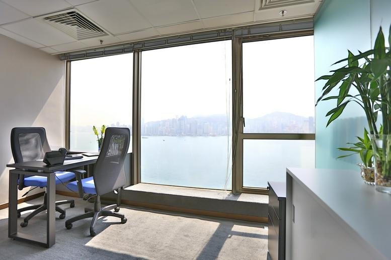 Private office at Wing On Plaza featuring a desk for two with expansive harbor views.