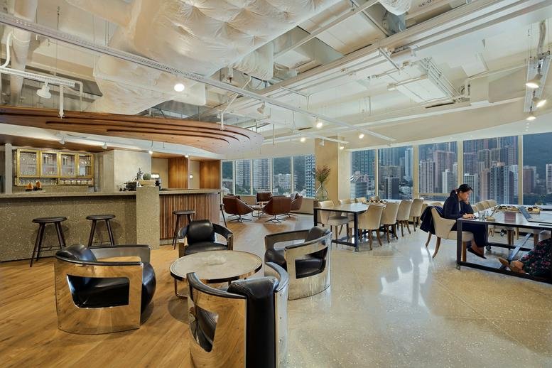 Spacious communal lounge at Two Pacific Place, Level 35 with modern seating and floor-to-ceiling city views.