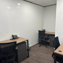 Private two-person office suite with desks and ergonomic chairs, Lippo Sun Plaza, Tsim Sha Tsui, Hong Kong.