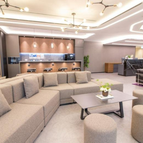 Modern lounge with grey sofa and bar area, The Lee Gardens, Causeway Bay, Hong Kong. Click for details.